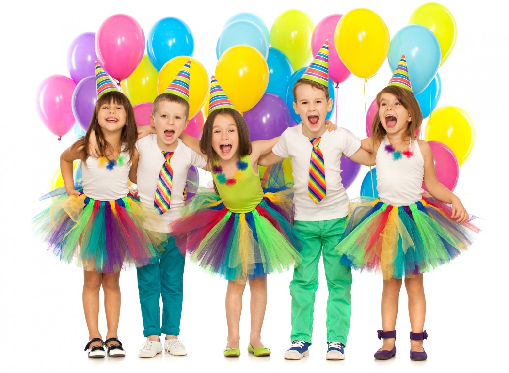 Group of joyful little kids having fun at birthday party. Isolated on white background. Holidays, birthday concept.